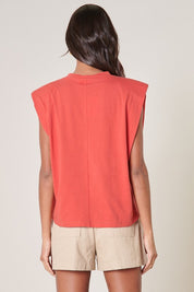 THE "PULL IT TOGETHER" SHOULDER PAD SLEEVELESS TEE IN CORAL