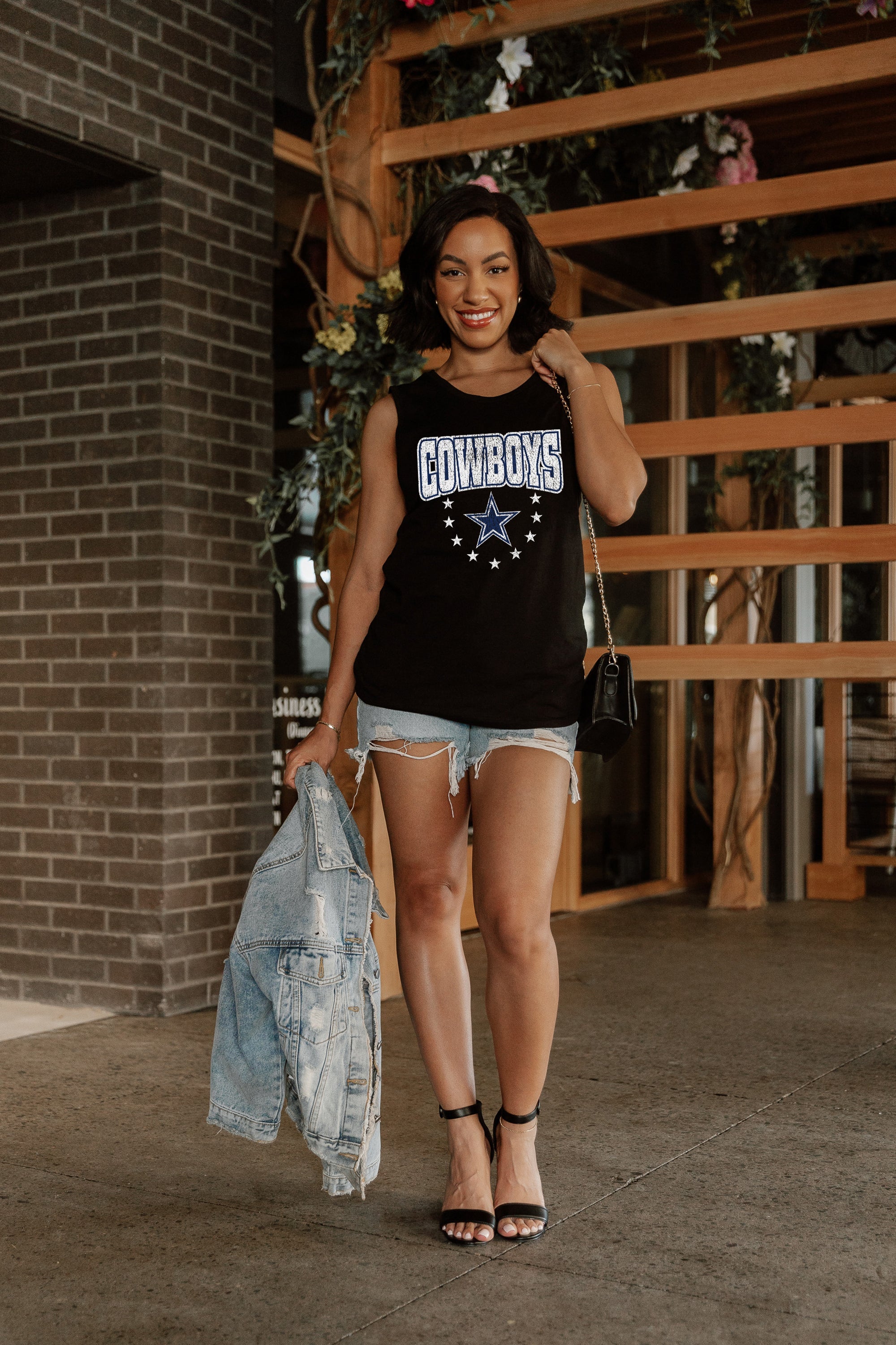 Black DALLAS COWBOYS BABY YOU'RE A STAR RACERBACK TANK TOP - On Model Pose | Gameday Couture - SOHO