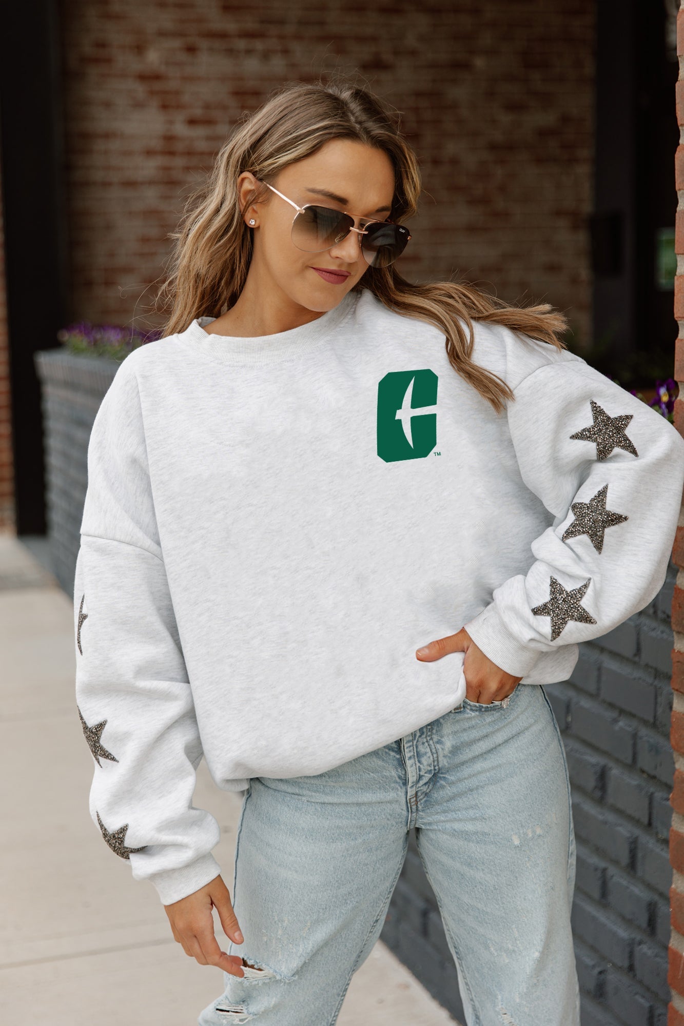 Ash Charlotte 49ers DEDICATION Star-Sleeve Crewneck Pullover - On Model Styled with Distressed Jeans Front View | Gameday Couture - SOHO