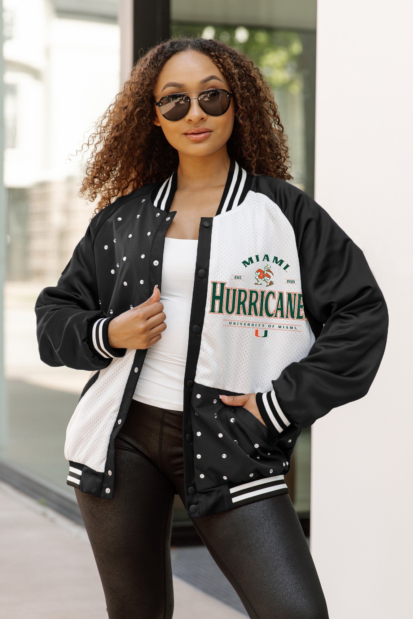 Black & White Miami Hurricanes Varsity Bomber Jacket - On Model Open Front View with Rhinestone Detail | Gameday Couture - SOHO