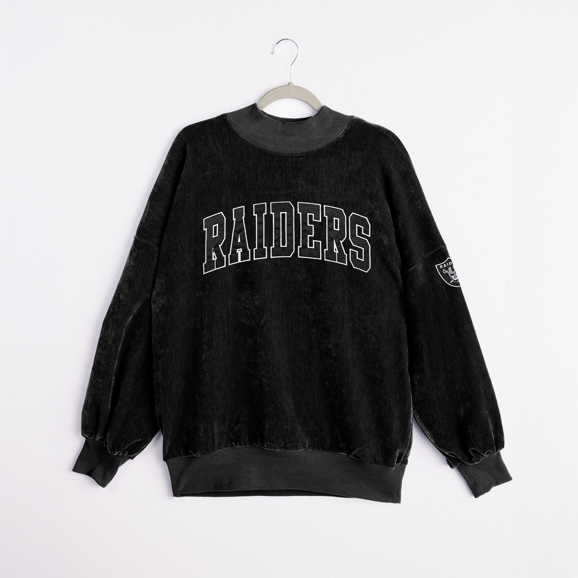 Black Raiders Chenille Pullover - Embroidered Sleeve Logo Detail Close-Up | Gameday Couture - SOHO