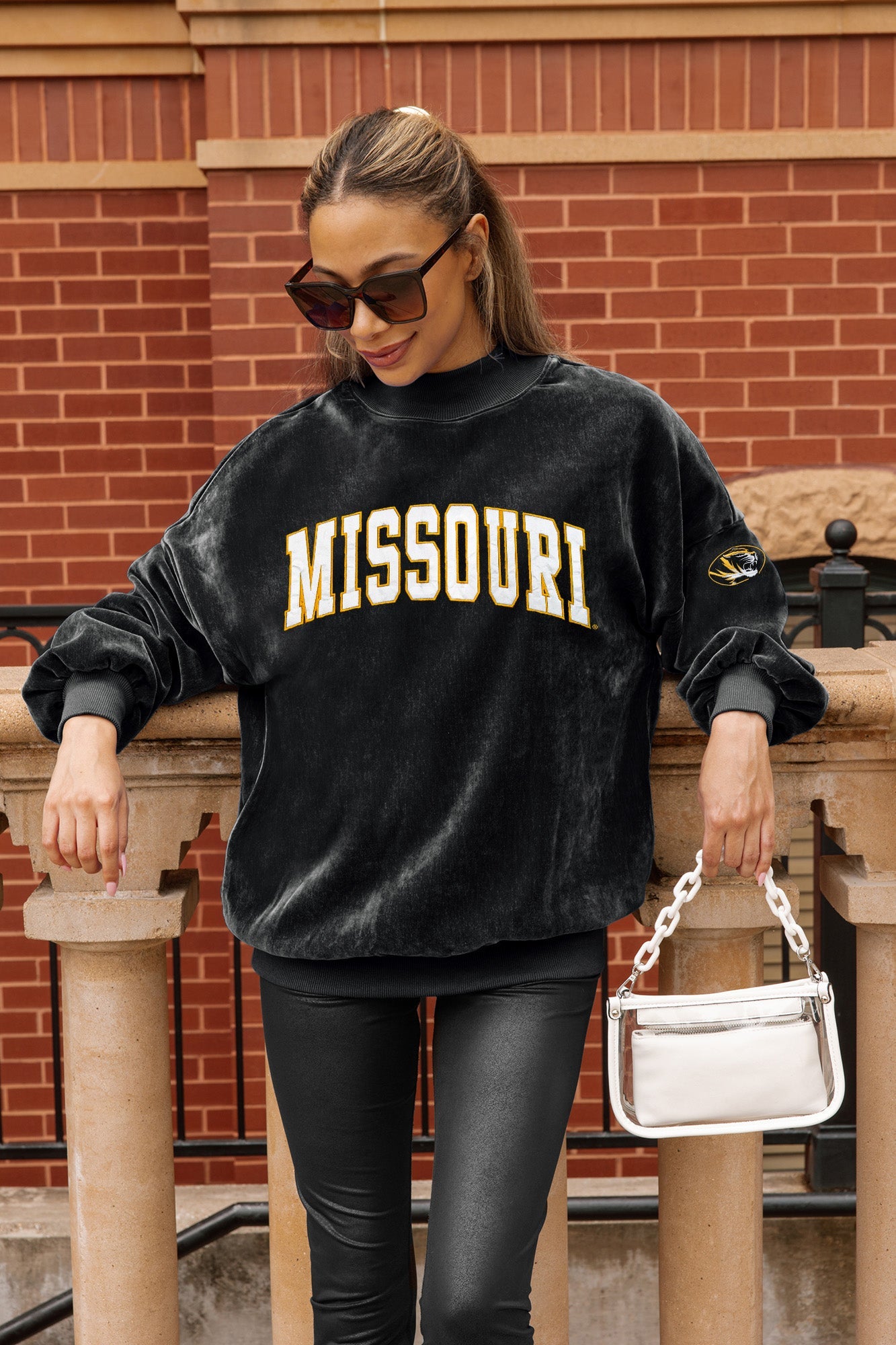 Black Mizzou chenille mock neck pullover on model leaning on stone railing - Front Logo Detail | Gameday Couture - SOHO