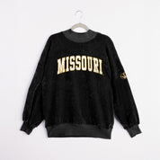 Black Mizzou game day chenille mock neck pullover styled with white mini skirt on staircase | Gameday Couture - SOHO