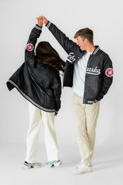 NEBRASKA CORNHUSKERS VARSITY MUSE OVERSIZED VARSITY UNISEX JACKET