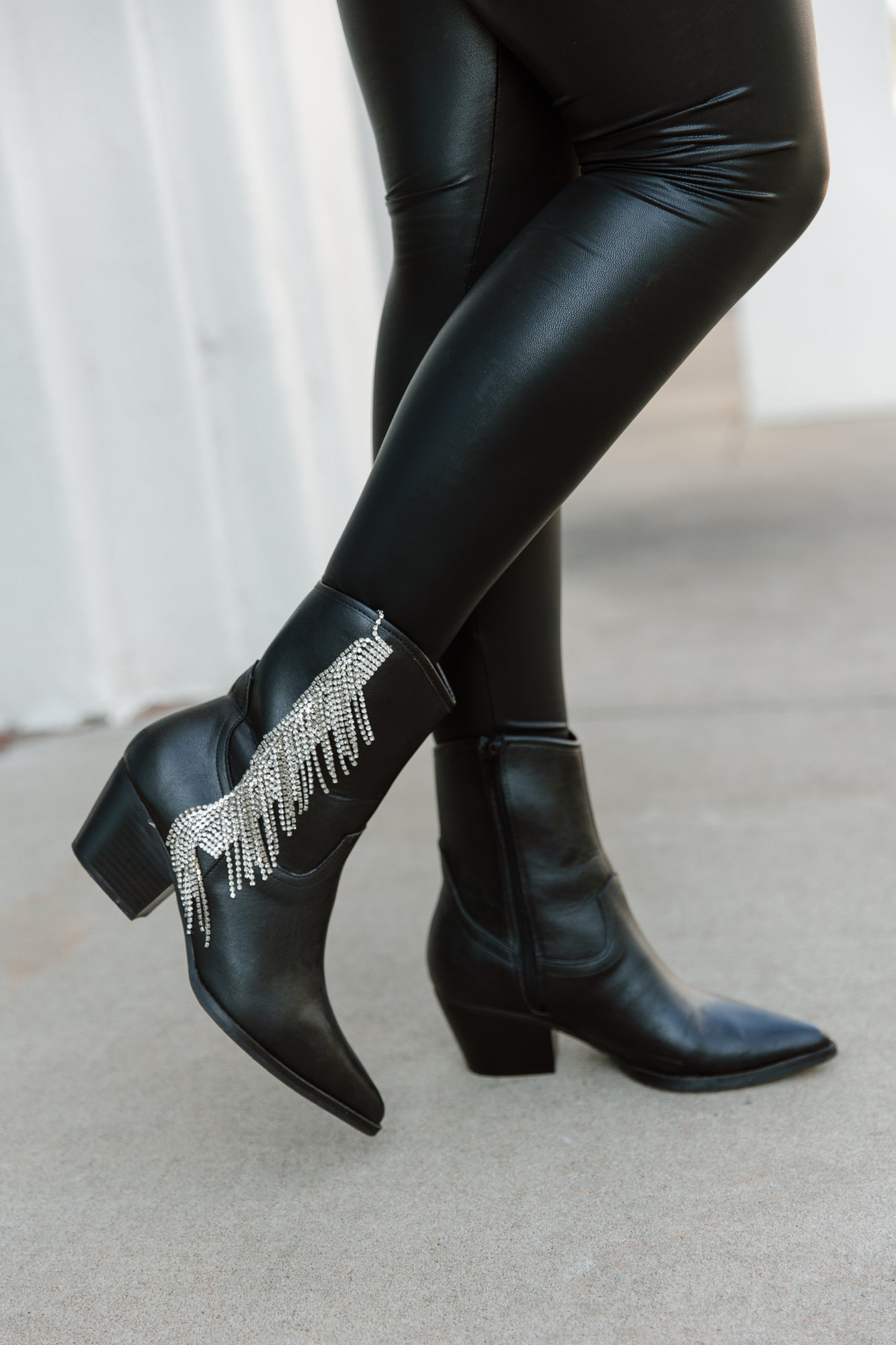 Black Leather Crystal Fringe Booties - Side Walking View | Gameday Couture - SOHO