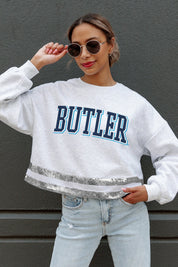 Ash/Silver Butler Bulldogs Pass The Shine Sequin Trim Mid-Crop Sweatshirt - Front On Model | Gameday Couture - SOHO