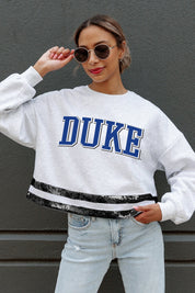 DUKE BLUE DEVILS PASS THE SHINE LONG SLEEVE METALLIC SHIMMER-STRIPE TOP WITH RIBBED NECKLINE AND CUFFS