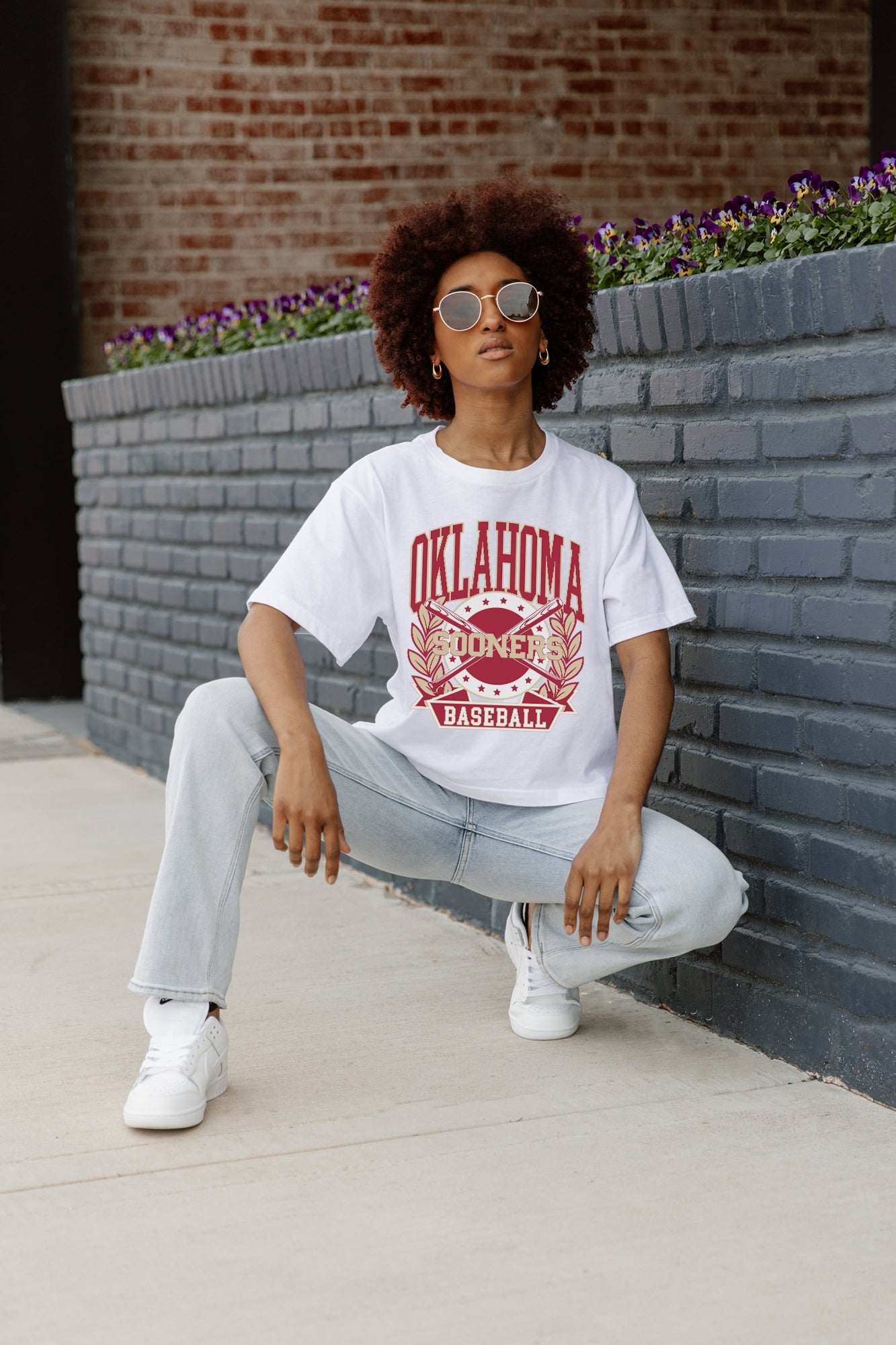 White OKLAHOMA SOONERS Bases Loaded Boxy Fit Women's Crop Tee - Seated Pose | Gameday Couture - SOHO