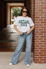 White Portland State Vikings CLAIM TO FAME Boxy Crop Tee - Full Body Front View, Brick Wall | Gameday Couture - SOHO