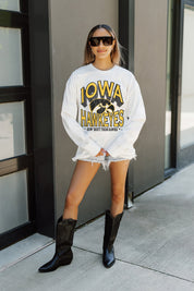 White Iowa Hawkeyes TIME OUT Oversized Long-Sleeve Tee - On-Model Front View Leaning Against Wall | Gameday Couture - SOHO