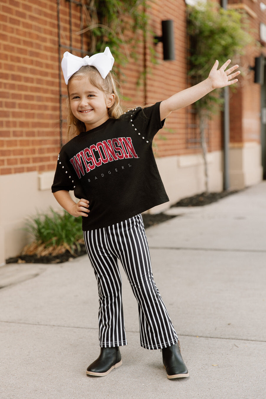 Black Wisconsin Badgers Kids Studded Crop Tee - On Model Action Pose, Game Day Kids Apparel | Gameday Couture - SOHO