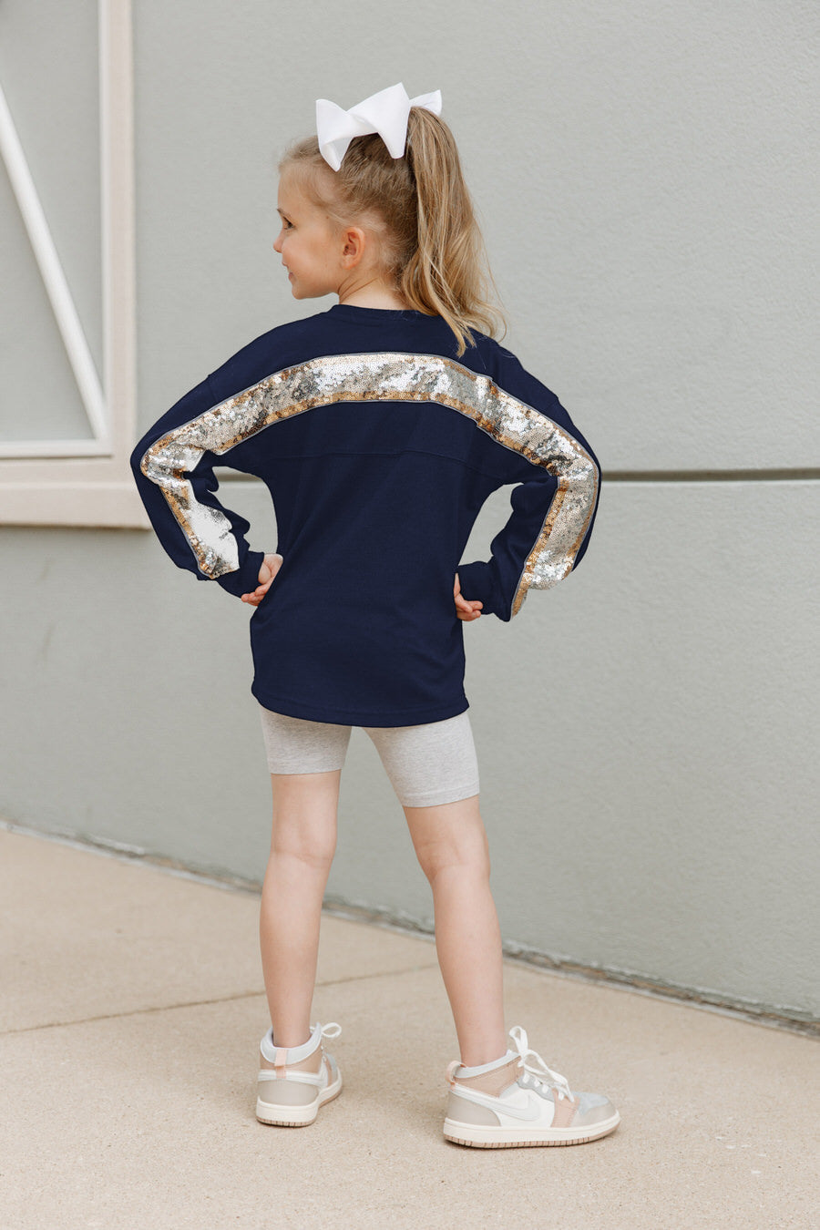 Navy Butler Bulldogs Guess Who's Back Kids Sequin Pullover - Back View Showing Sequin Yoke Detail | Gameday Couture - SOHO