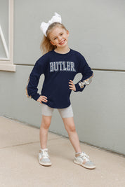Navy Butler Bulldogs Guess Who's Back Kids Sequin Yoke Pullover - Front View On Child Model | Gameday Couture - SOHO