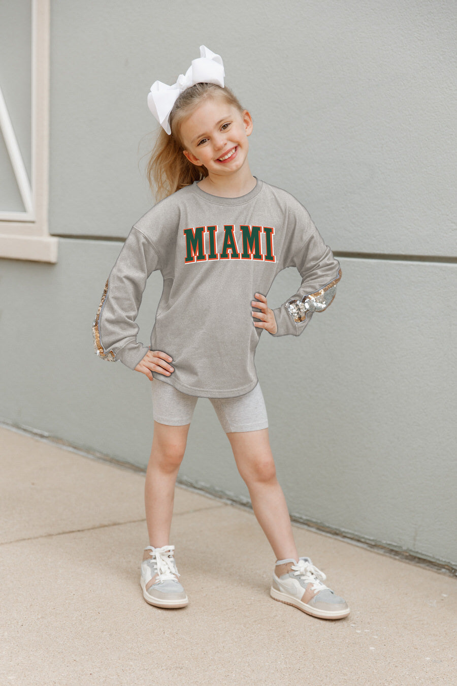 Grey Miami Hurricanes GUESS WHO'S BACK Kids Sequin Pullover - Front View On Model | Gameday Couture - SOHO