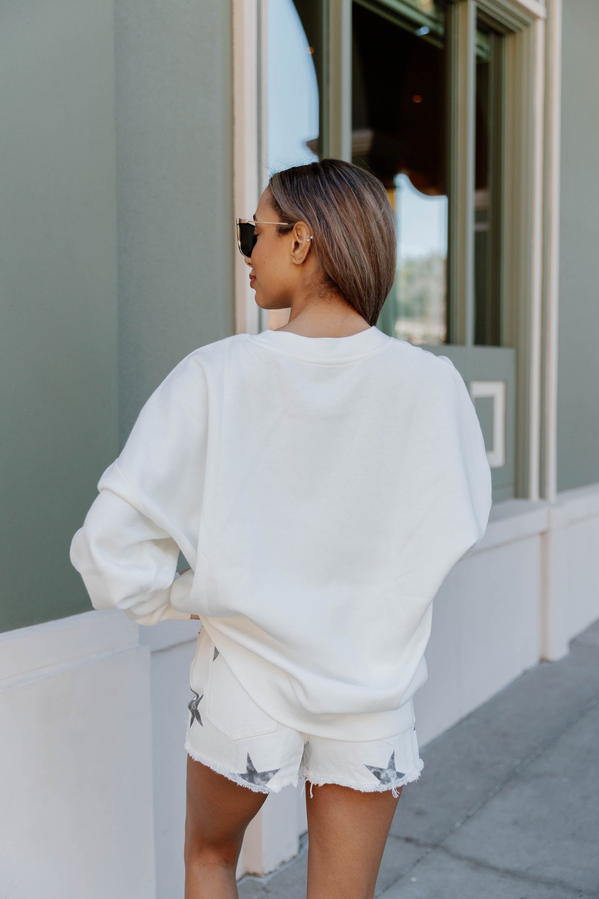 White NORTH DAKOTA STATE BISON SUPERSTAR Fleece Crewneck Pullover - On Model Side Profile Styled Look | Gameday Couture - SOHO
