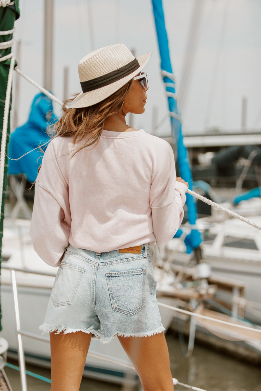 Pink I'D RATHER BE AT THE LAKE Vintage Oversized Washed Sweatshirt - Back View On Model | Gameday Couture - SOHO